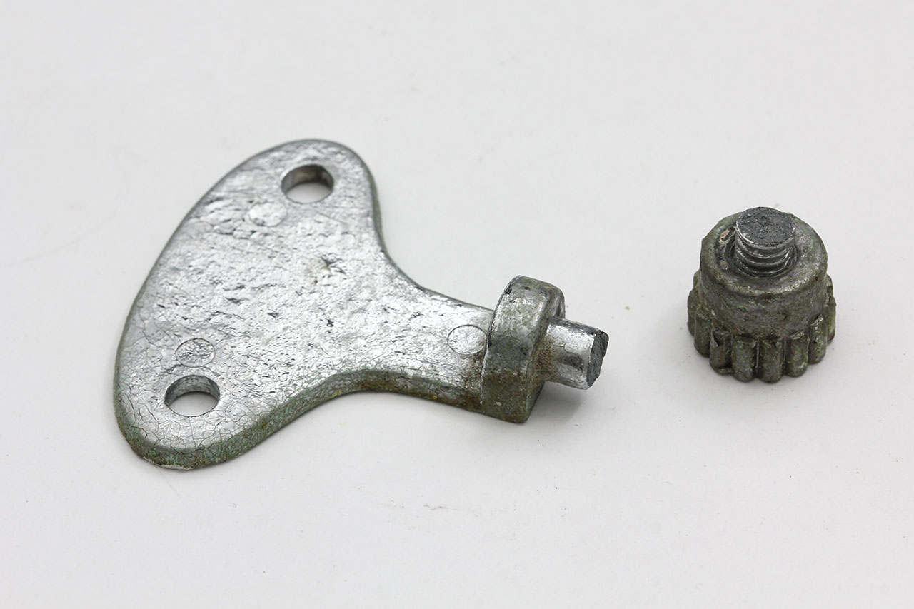 broken mirror bracket, snapped off at the screw portion with the thumbnut still attached